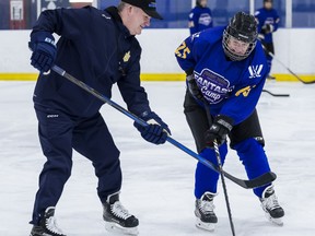 Kiki Moore McConnell competes against Troy Ryan at PWHL fantasy camp.