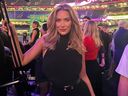 Paige Spiranac poses for a photo at the Super Bowl.