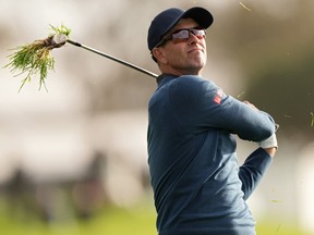 Adam Scott of Australia plays his shot on the 18th hole during the second round of The Genesis Invitational.