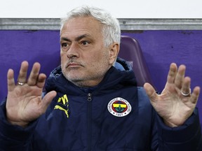 Fenerbahce coach Jose Mourinho gestures from the technical area during a match.