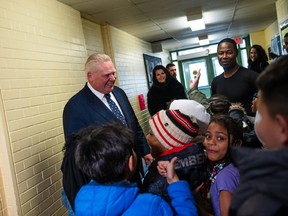 Progressive Conservative Leader Doug Ford speaks to elementary school students before voting in the Ontario provincial election, at Westmount Junior School in Etobicoke, Ont., on Thursday, Feb.27, 2025.