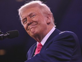U.S. President Donald Trump smiles as he addresses the annual Conservative Political Action Conference at the Gaylord National Resort & Convention Center at National Harbor in Oxon Hill, Maryland, Saturday, Feb. 22, 2025.