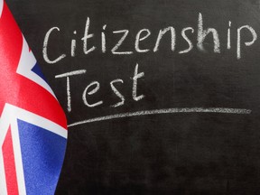 UK flag and citizenship test on chalkboard.
