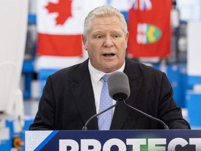 Ontario PC Leader Doug Ford speaks while London, Ont. Mayor Josh Morgan listens during a press conference at Starlim North America Corporation in London, Ontario on Thursday January 30, 2025.  Derek Ruttan/Postmedia Network