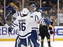 Leafs’ Mitch Marner celebrates his OT winner with goalie Anthony Stolarz in Boston on Tuesday. Maddie Meyer/Getty Images