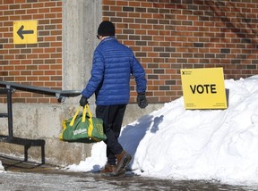 Someone on his way to vote early at the Canterbury Recreation Complex in Ottawa Thursday, Feb. 27, 2025.