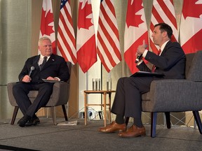 Ontario Premier Doug Ford listens as Neil Herrington, senior vice-president of the Americas Program for the U.S. Chamber of Commerce, speaks.