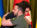 Prime Minister Justin Trudeau hugs Ukrainian President Volodymyr Zelenskyy during a meeting in Kyiv, Ukraine, on Saturday, June 10, 2023.