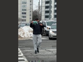 Toronto Police said Marco Antonio Munoz, 37, of Mississauga (pictured), has been charged with assault with a weapon. He is accused of assaulting a woman at a protest with a stuffed animal (pictured). (Caryma Sa'd photo)