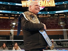 Premier Doug Ford holds a ceremonial belt ahead of the WWE taking over Rogers Centre for events this weekend.
