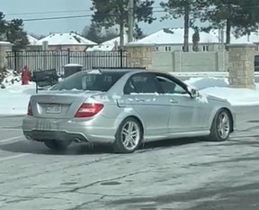 Investigators need help identifying two men who carjacked a woman at knifepoint while she was at a Brampton gas station and stole her silver Mercedes Benz C300 sedan (seen here) on Tuesday, Feb. 11, 2025.
