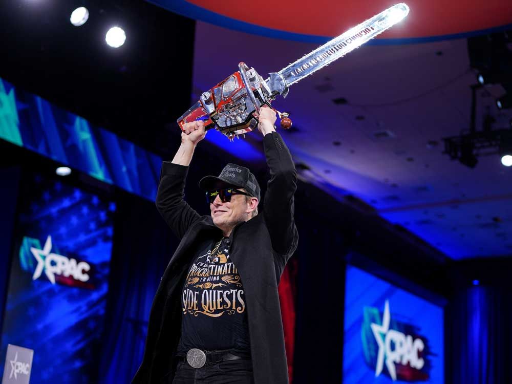 Elon Musk waves a chainsaw at CPAC talking up Trump’s cost-cutting efforts