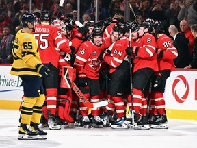 Mitch Marner #16 of Team Canada (c) celebrates his overtime game-winning goal against Team Sweden in the NHL 4 Nations Face-Off at Bell Centre on February 12, 2025 in Montreal, Quebec, Canada. Team Canada defeated Team Sweden 4-3 in overtime.