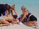 Canadian woman being treated after getting attacked by shark that bit off both hands in Turks and Caicos.
