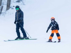 A father and son ski on opening day at Boler Mountain in London, Ont., on Thursday Dec. 12, 2024.