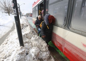 TTC riders found it difficult to exit the rear doors of a Danforth bus thanks to hardened snowbanks on Thursday, Feb. 20, 2025.