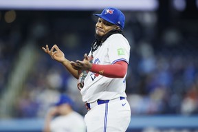 Blue Jays' Vladimir Guerrero Jr. reacts after an overturned play to award him the out against Anthony Volpe of the New York Yankees during a game at Rogers Centre on April 17, 2024.
