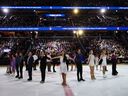 Skaters salute during the Legacy On Ice U.S. Figure Skating Benefit at Capital One Arena.