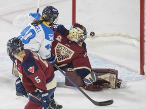 Toronto Sceptres' Blayre Turnbull (40) looks on as Montreal Victoire goalie Ann-Renee Desbiens (30) is scored on by Sceptres' Jesse Compher (not shown).