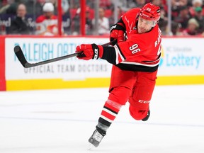 Mikko Rantanen of the Carolina Hurricanes takes a shot against the Calgary Flames.