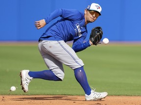 Toronto Blue Jays second baseman Andrés Giménez fields a ground ball during spring training in Dunedin Fla..