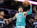 Charlotte Hornets guard Lamelo drove the ball to the Orlando Magic’s rim.