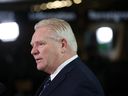 Ontario Premier Doug Ford speaks to the press during the first Ministers Meeting in Ottawa on March 21, 2025.
