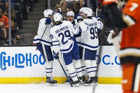 Steven Lorentz #18 of the Toronto Maple Leafs celebrates his goal with David Kampf #64, Pontus Holmberg #29 and Oliver Ekman-Larsson #95 during the third period against the Anaheim Ducks at Honda Center on March 30, 2025 in Anaheim, California. (Photo by Ric Tapia/Getty Images)