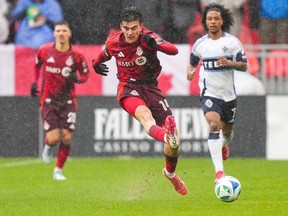 Toronto Football Club midfielder Alonso Coello (14) runs in the first half of Vancouver Whitecaps forward Jayden Nelson (7) in MLS runs in the MLS action in Toronto on Saturday, March 29, 2025.