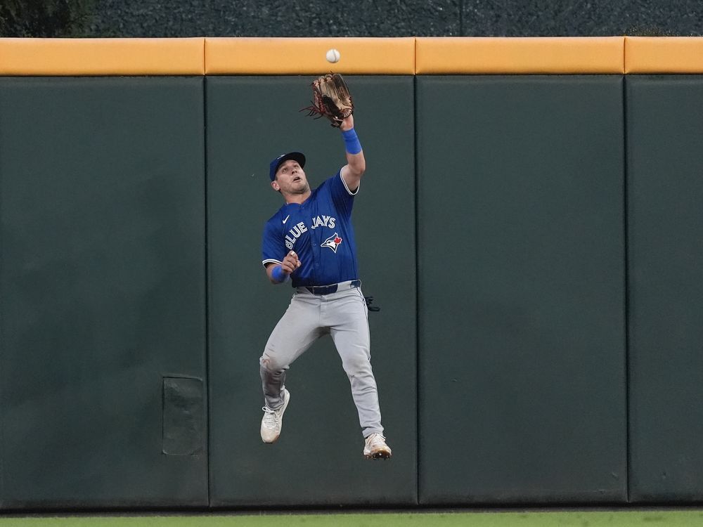 Toronto Blue Jays center fielder Daulton Varsho catches a fly ball off the bat of Atlanta Braves' Michael Harris II in the fourth inning of a baseball game on Sept. 6, 2024, in Atlanta.