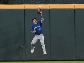 Toronto Blue Jays center fielder Daulton Varsho catches a fly ball off the bat of Atlanta Braves' Michael Harris II in the fourth inning of a baseball game on Sept. 6, 2024, in Atlanta.