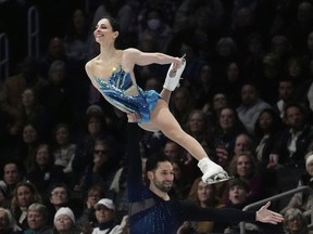 Deanna Stellato-Dudek and Maxime Deschamps, of Canada, perform during the pairs free skating program at the figure skating world championships, Thursday, March 27, 2025, in Boston.