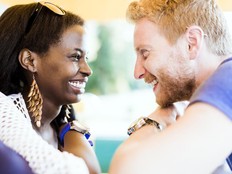 Romantic couple smiling while looking into each others eyes