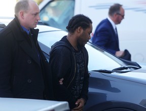 (FILE PHOTO) Kingston police escort Mark Anthony Bollers, 27, of Toronto, into court for a bail hearing in Kingston, Ont., on Thursday, April 13, 2017.