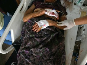 An earthquake survivor is transported in the compound of a hospital in Naypyidaw on March 28, 2025, after an earthquake in central Myanmar.