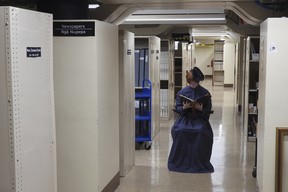 A tour guide at New Zealand's parliament gives a spooky tour of the historical Parliament library. (AP Photo/Charlotte Graham-McLay)