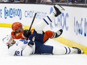 Ducks forward Frank Vatrano and Leafs defender Oliver Ekman Larsson stumbling in Anaheim on Sunday. Ric Tapia/Getty Images