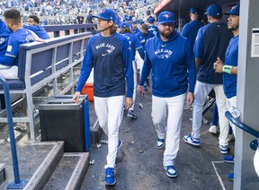Blue Jays pitcher Kevin Gausman and manager John Schneider leave the dugout after a loss to the Miami Marlins in their final regular-season game of 2024 at the Rogers Centre on Sept. 29, 2024 in Toronto. MARK BLINCH/GETTY IMAGES