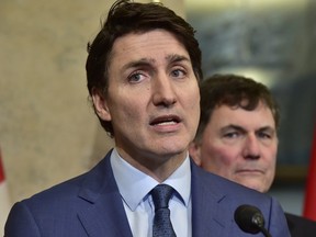 Prime Minister Justin Trudeau addresses Canadians in the wake of the trade war and U.S. President Donald Trump's tariffs in the lobby of the West Block in Ottawa, Ontario. on Monday, March 4, 2025