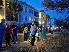 Daniel Island residents held a vigil for Walter the alligator. CREDIT: Susan Chapman