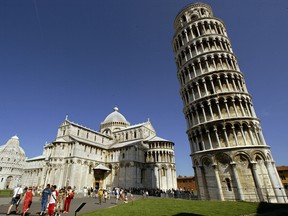 Tourists visit the Leaning Tower of Pisa