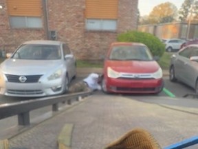 Screenshot of tow truck driver getting head run over as he attempted to hook up seized vehicle to his tow truck.