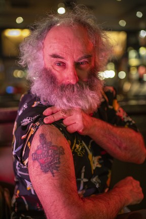 Dave Harvey shows off his Hard Rock Cafe tattoo. CREDIT: Joshua Bright for The Washington Post