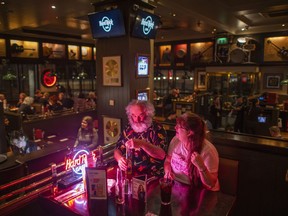 Dave and Val Harvey at their table at the London Hard Rock Cafe. CREDIT: Joshua Bright for The Washington Post
