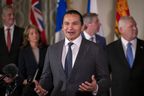 Premier of Manitoba Wab Kinew, accompanied by other Council of the Federation members, speaks to reporters at the Mayflower Hotel in Washington, Wednesday, Feb. 12, 2025.