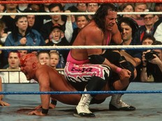 Bret Hart locking the Sharpshooter on Stone Cold Steve Austin at Wrestlemania 13.
