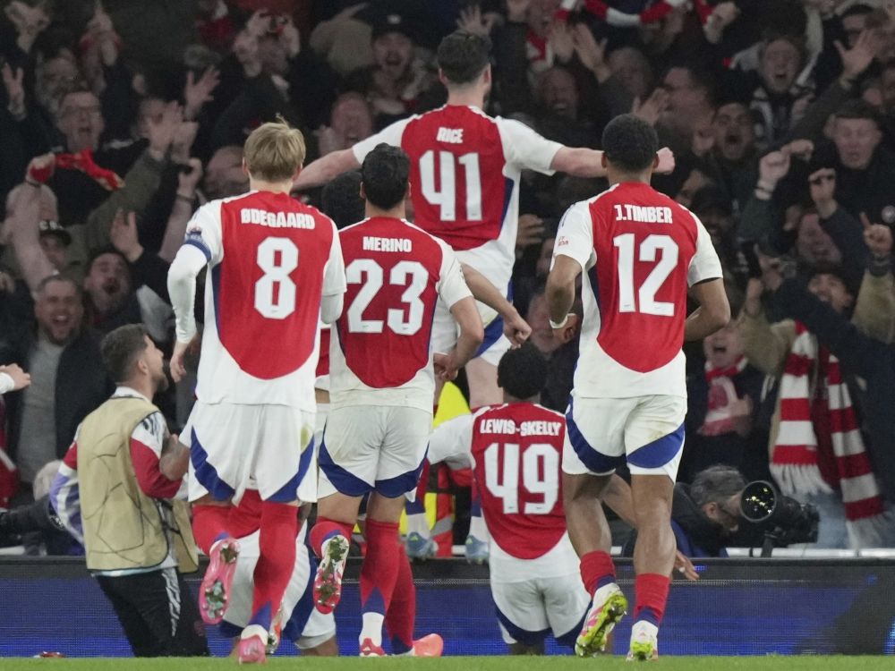 Arsenal's Declan Rice, top, celebrates after scoring his side's second goal during the Champions League quarterfinals against Real Madrid.