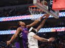 Toronto Raptors' Scottie Barnes defended Anthony Davis of the Dallas Mavericks' Anthony Davis on April 11, 2025.
