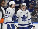 Toronto Maple Leafs right winger Mitch Marner (right) celebrates his goal against the Tampa Bay Lightning with Auston Matthews.