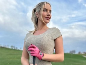 Paige Spiranac poses in a bodysuit while hitting the driving range.